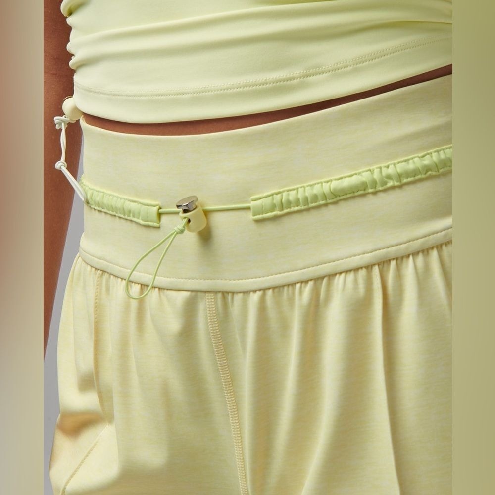 Travis Mathew's Yellow High-Waisted Athletic Shorts with Drawstring & Pockets - Picture 3 of 10